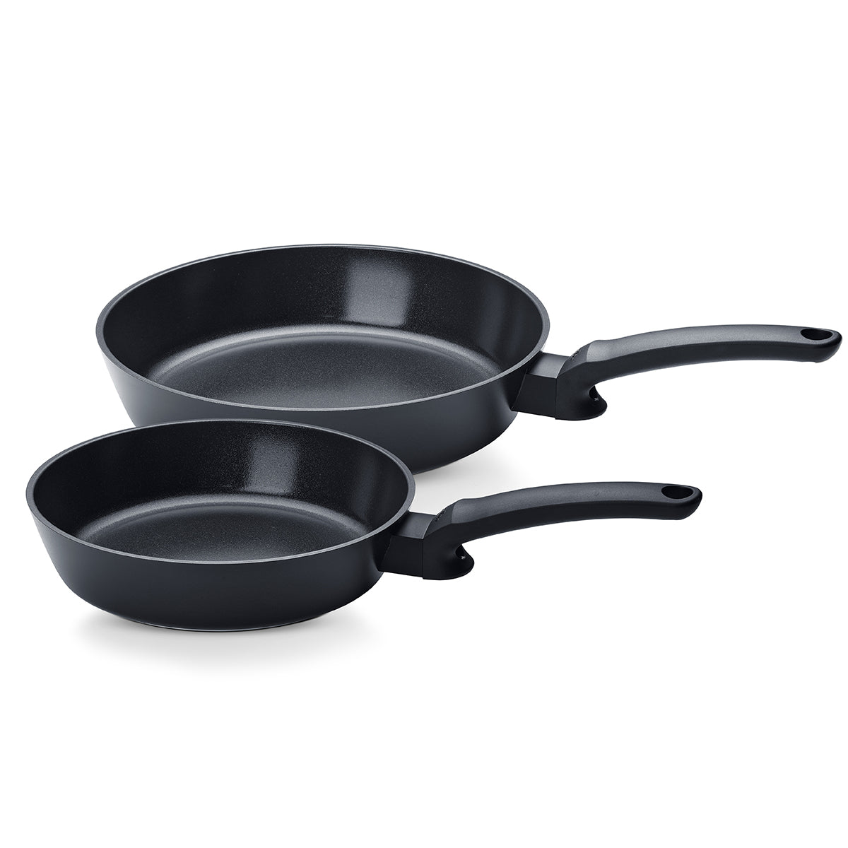 Fissler Ceratal® Evo Comfort Frying Pan Set: two smooth black non-stick pans (24 cm and 28 cm), side by side on a white background.