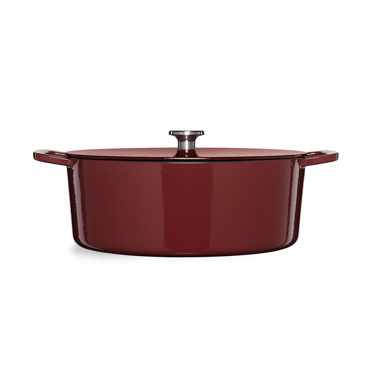 Fissler Moments Oval Dutch Oven aus rotem Gusseisen - modern, langlebig, mit silbernem Knauf und Seitengriffen. Präzision "Made in Germany".
